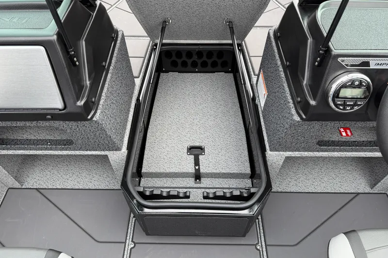 Slide: The Image of 2026 Lund 1775 Impact XS Sport boat interior with open storage compartment. - 12