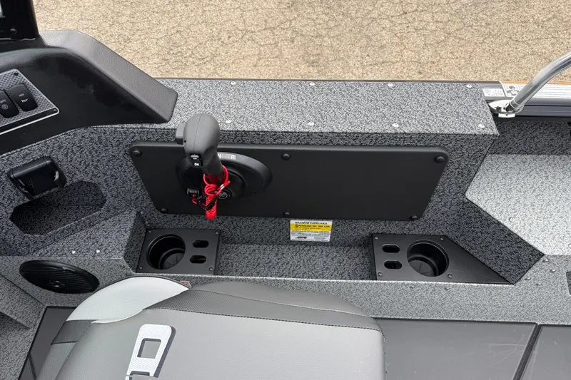 Slide: The Image of Interior of 2026 Lund 1775 Impact XS Sport boat, featuring control panel and cup holders. - 17