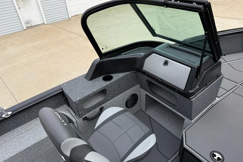 Slide: The Image of 2026 Lund 1775 Impact XS Sport boat interior with gray seating and console. - 19