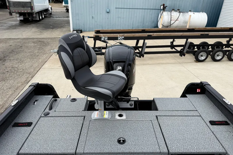 Slide: The Image of 2026 Lund 1775 Impact XS Sport boat with a comfortable seat and powerful motor. - 25