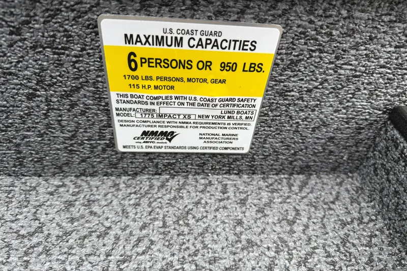 Slide: The Image of Capacity label on 2026 Lund 1775 Impact XS Sport boat, 6 persons or 950 lbs limit. - 29
