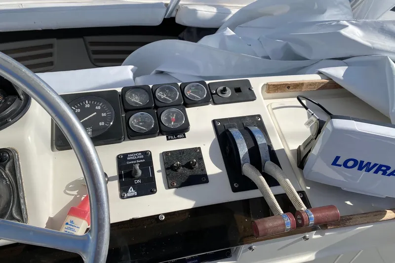 Slide: The Image of Control panel of a 1988 Luhrs Tournament 320 Convertible boat with gauges and Lowrance equipment. - 18