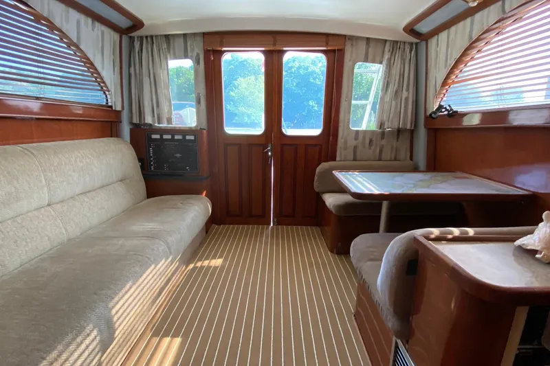 Slide: The Image of Interior of 1988 Luhrs Tournament 320 Convertible with seating and wooden accents. - 3