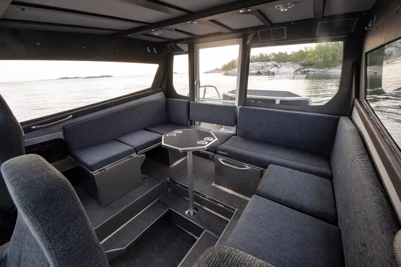 Slide: The Image of Luxurious interior of 2024 Viggo C10 boat with spacious seating and scenic water view. - 15