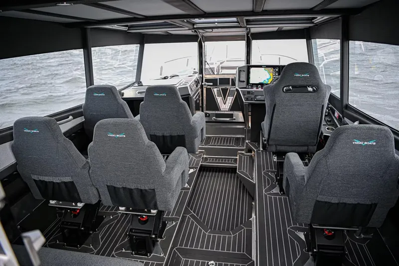 Slide: The Image of Interior of 2024 Viggo C10 boat with modern seating and navigation equipment. - 16