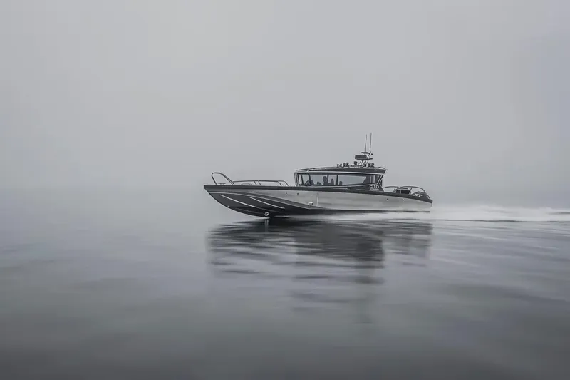 Slide: The Image of 2024 Viggo C10 boat cruising on calm, misty waters. - 20