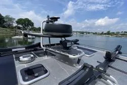 Slide: The Image of 2021 Viggo C10 boat deck with advanced navigation equipment, docked by a scenic lake. - 6