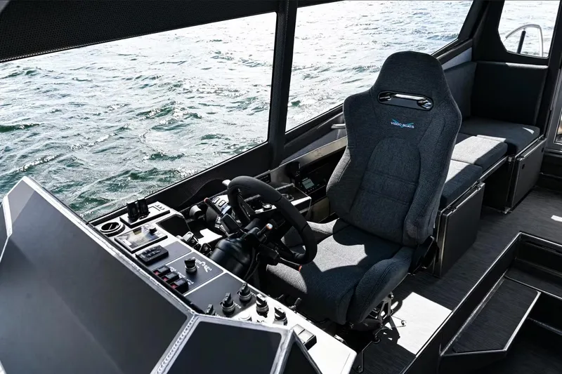 Slide: The Image of Interior of 2024 Viggo C10 boat with modern helm and comfortable seating. - 9