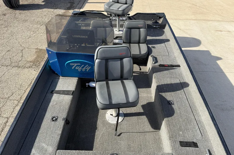 Slide: The Image of 1997 Tuffy 1700 ESOX MAGNUM fishing boat interior with seating and Lowrance equipment. - 11