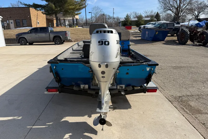 Slide: The Image of 1997 Tuffy 1700 ESOX MAGNUM boat with Honda 90 outboard motor on trailer. - 3