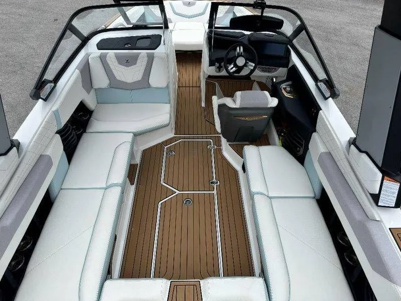 Slide: The Image of Interior of a 2022 Nautique G23 boat with luxurious seating. - 16