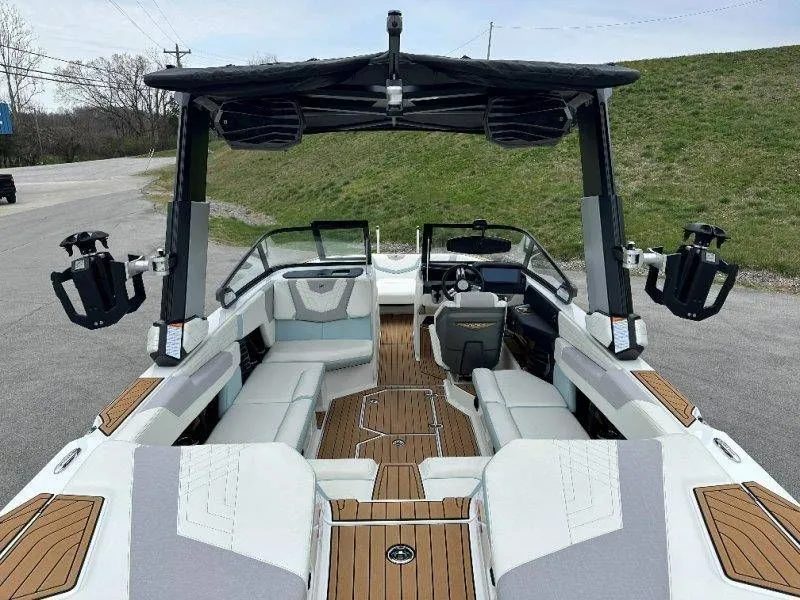 Slide: The Image of Interior view of a 2022 Nautique G23 boat with luxurious seating. - 20