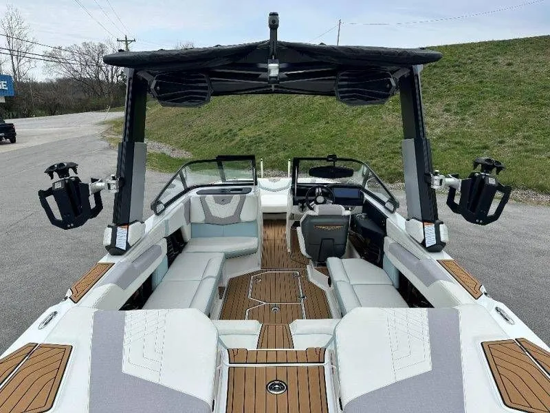 Slide: The Image of Interior view of a 2022 Nautique G23 boat with luxurious seating. - 26