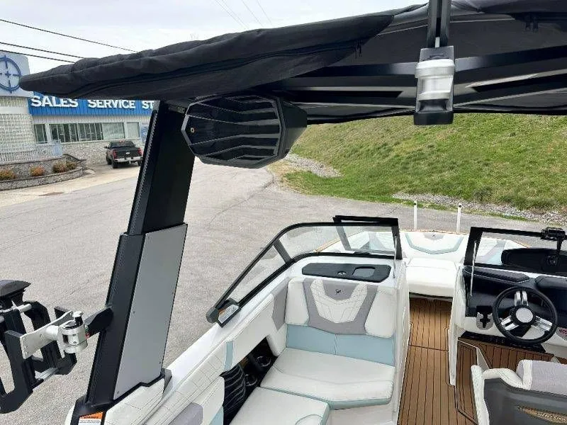 Slide: The Image of Interior view of a 2022 Nautique G23 boat with modern seating. - 27