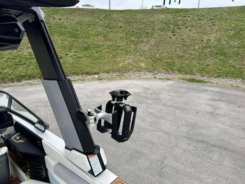 Slide: The Image of Nautique G23 2022 boat with wakeboard rack, side view. - 29