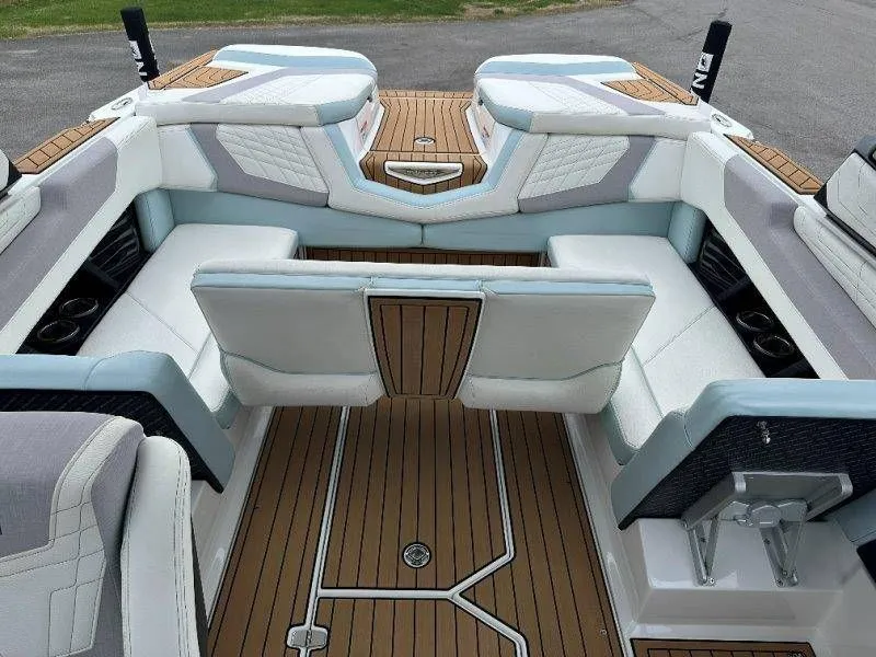 Slide: The Image of Interior of a 2022 Nautique G23 boat with luxurious seating. - 40
