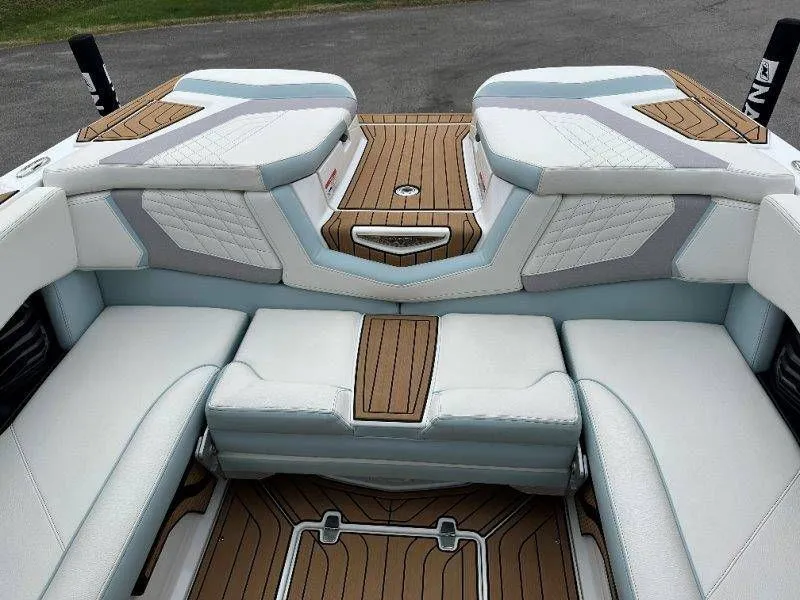 Slide: The Image of Interior of a 2022 Nautique G23 boat with luxurious seating. - 43