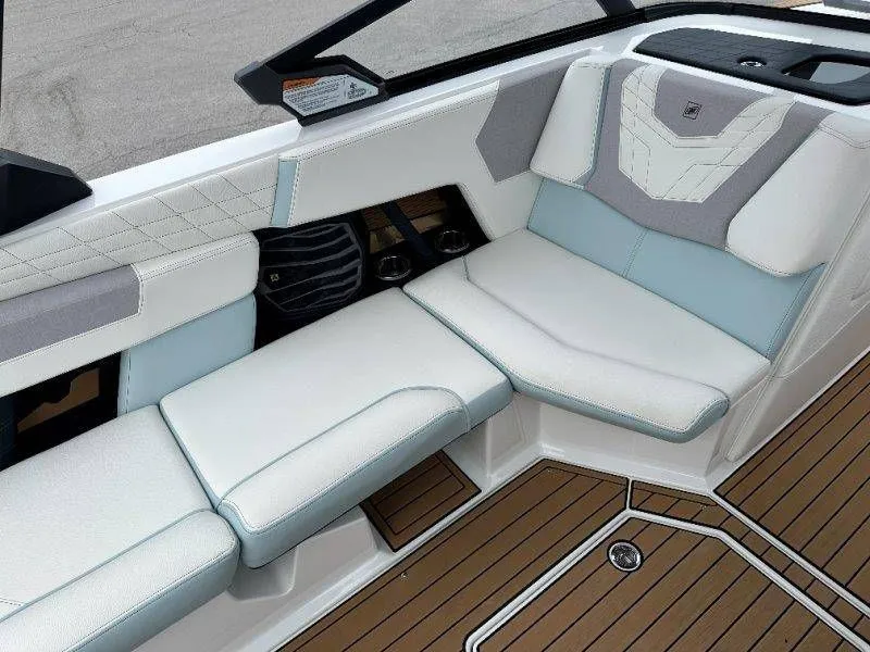 Slide: The Image of Interior of 2022 Nautique G23 with sleek seating and wood flooring. - 45