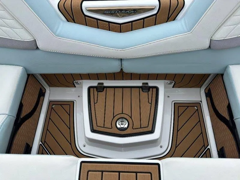 Slide: The Image of Interior of 2022 Nautique G23 with wood flooring and upholstery. - 46