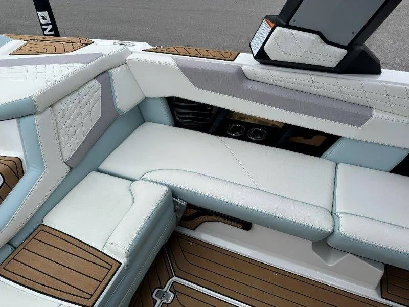 Slide: The Image of Interior of a 2022 Nautique G23 boat with luxurious seating. - 48