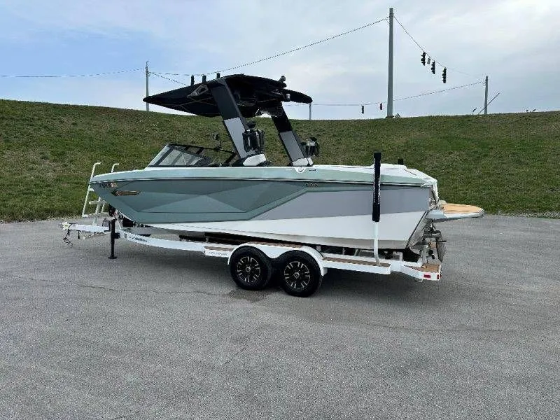 Slide: The Image of 2022 Nautique G23 boat on trailer, side view. - 6