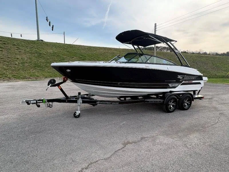 Slide: The Image of 2023 Monterey 218SS Super Sport boat on trailer, side view. - 11