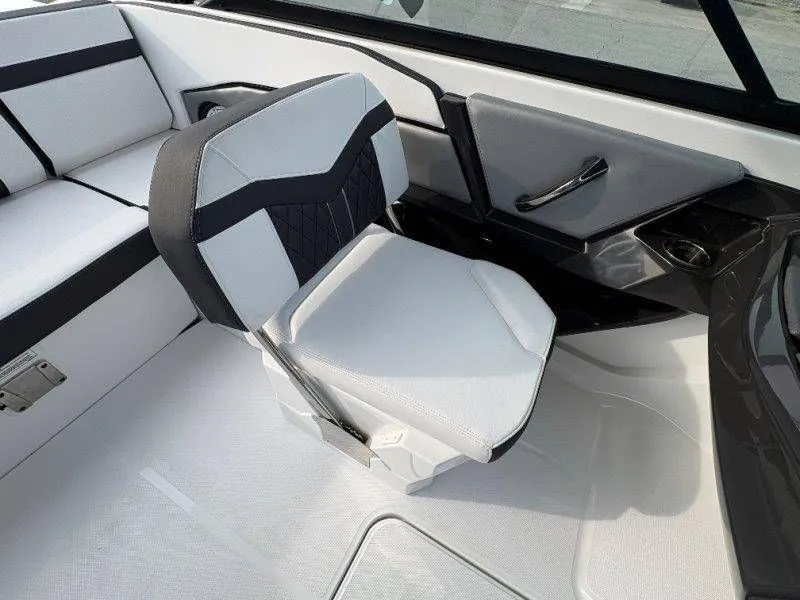 Slide: The Image of Interior of 2023 Monterey 218SS Super Sport boat, white and black upholstery. - 21