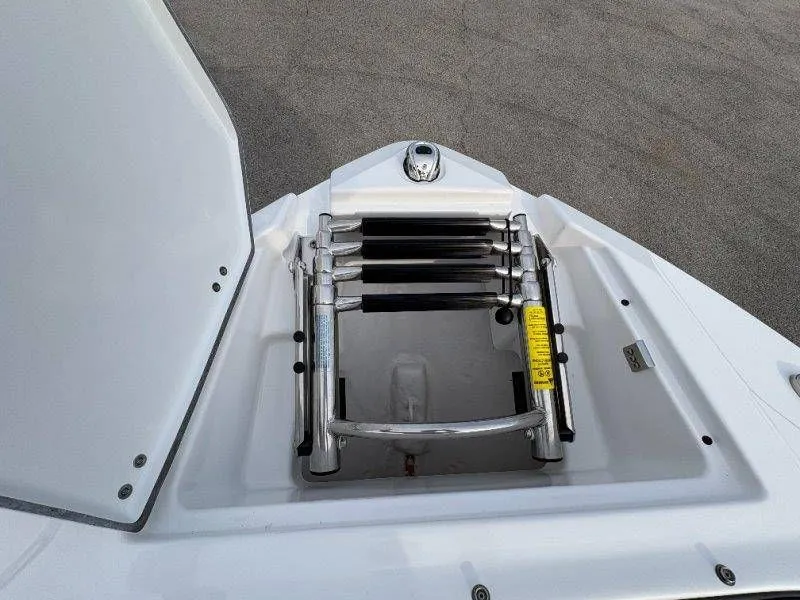 Slide: The Image of 2023 Monterey 218SS Super Sport boat ladder in storage compartment. - 27