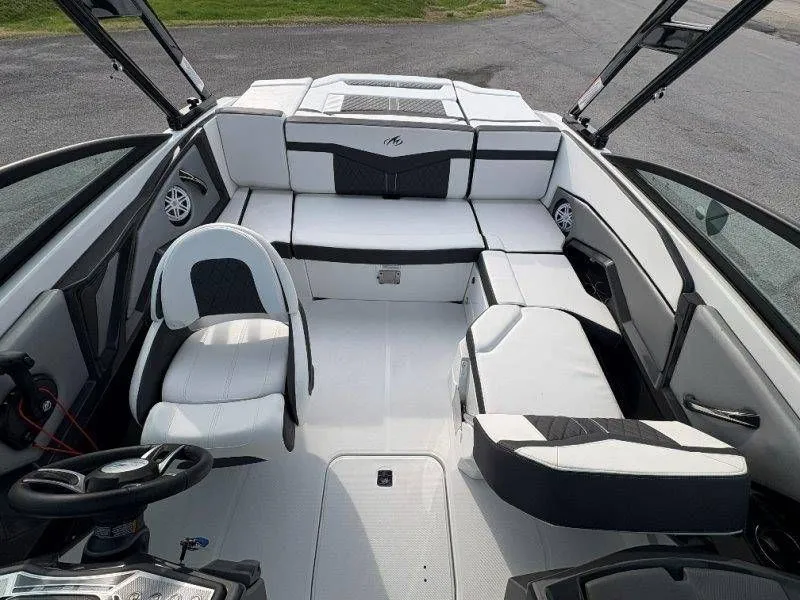 Slide: The Image of Interior of 2023 Monterey 218SS Super Sport boat, luxurious white upholstery. - 30
