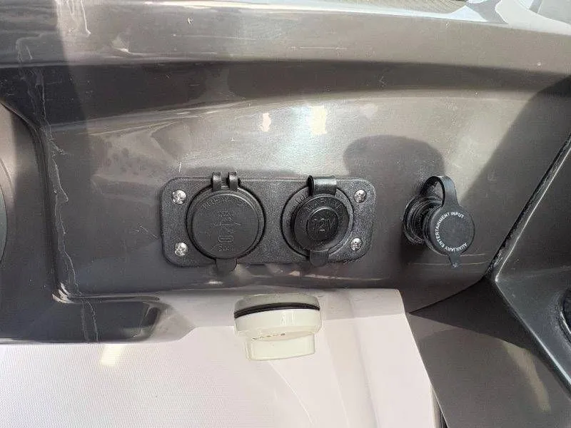 Slide: The Image of 2023 Monterey 218SS Super Sport dashboard with power outlets. - 34