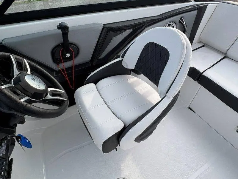 Slide: The Image of Interior of 2023 Monterey 218SS Super Sport boat, white seat and steering wheel. - 40