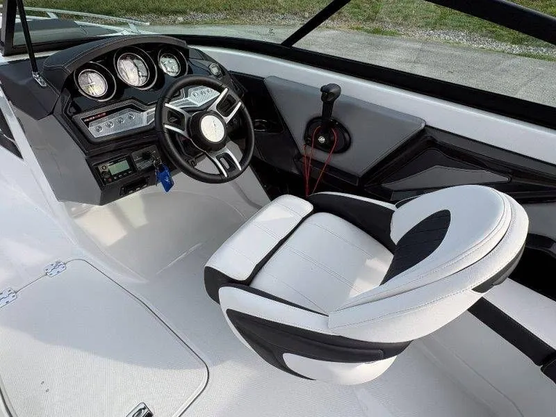 Slide: The Image of Interior of 2023 Monterey 218SS Super Sport boat with steering console. - 45