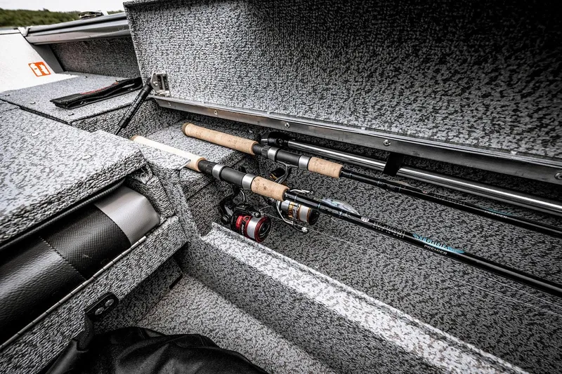 Slide: The Image of Manufacturer Provided Image: 2025 Lund 1775 Impact XS Sport boat interior with fishing rod storage. - 9