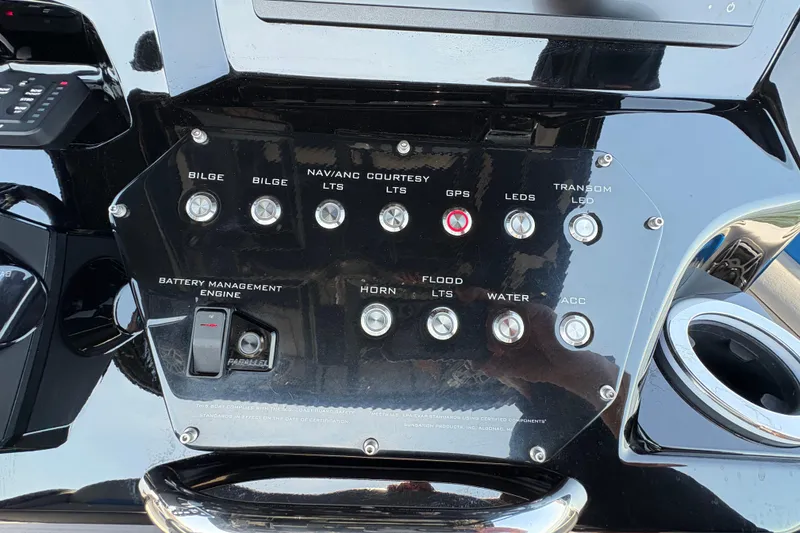 Slide: The Image of Control panel of 2024 Sunsation 32 CCX boat with various switches and indicators. - 10