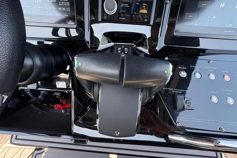 Slide: The Image of Control panel of 2024 Sunsation 32 CCX boat with throttle and navigation buttons. - 11