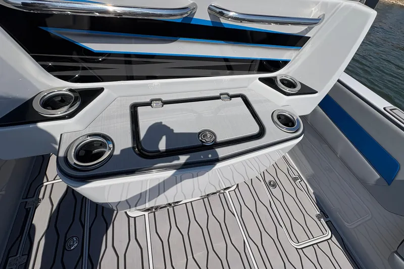 Slide: The Image of 2024 Sunsation 32 CCX boat interior with sleek design and cup holders. - 15