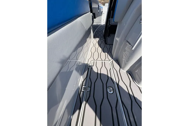 Slide: The Image of 2024 Sunsation 32 CCX boat interior with sleek, modern flooring design. - 19