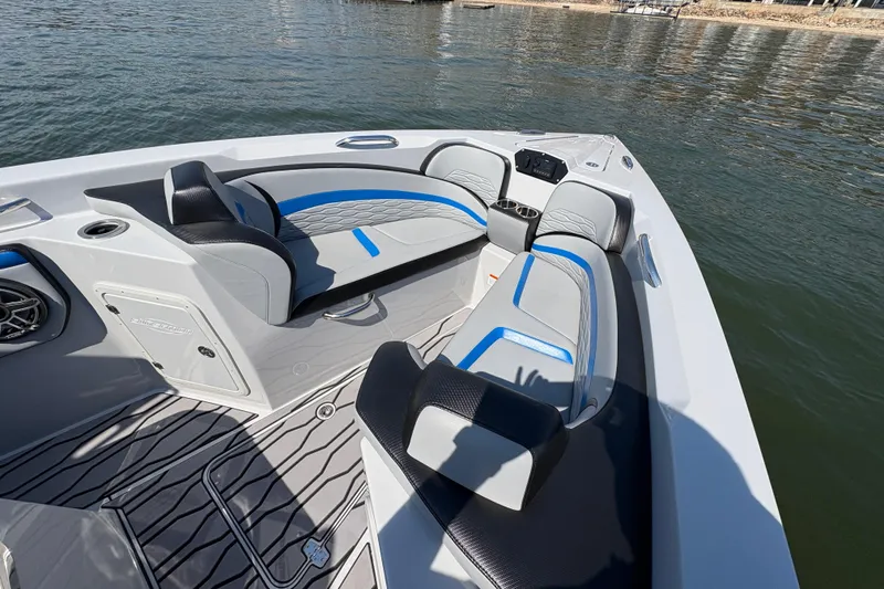 Slide: The Image of 2024 Sunsation 32 CCX boat interior with sleek seating and modern design on the water. - 23