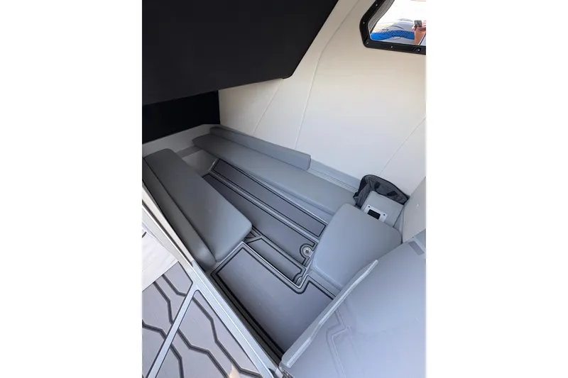 Slide: The Image of 2024 Sunsation 32 CCX cabin interior with gray seating and modern design. - 29