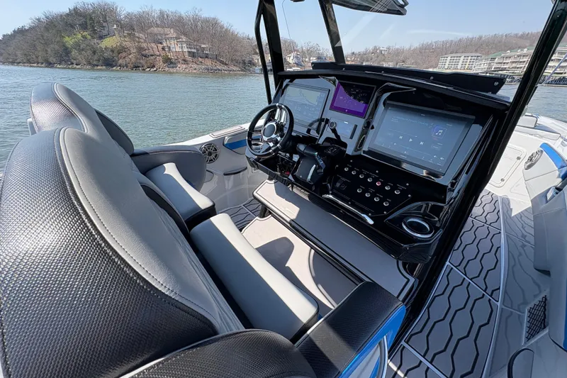 Slide: The Image of 2024 Sunsation 32 CCX boat cockpit with advanced navigation and control systems. - 4