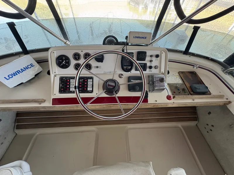 Slide: The Image of 1983 Mainship 34 Mark III helm with Lowrance equipment. - 14