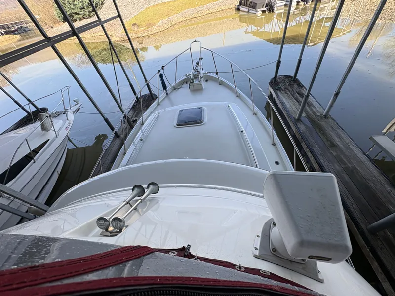 Slide: The Image of 1983 Mainship 34 Mark III boat docked in harbor. - 16