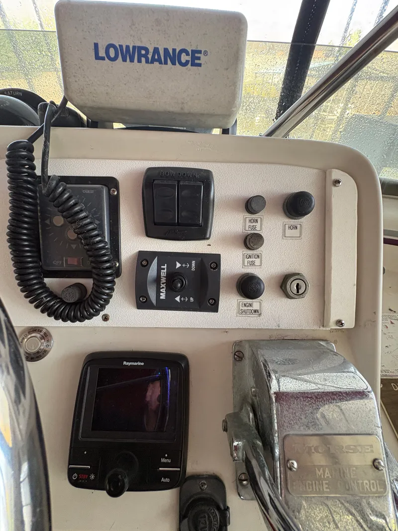 Slide: The Image of 1983 Mainship 34 Mark III helm with Lowrance device. - 18