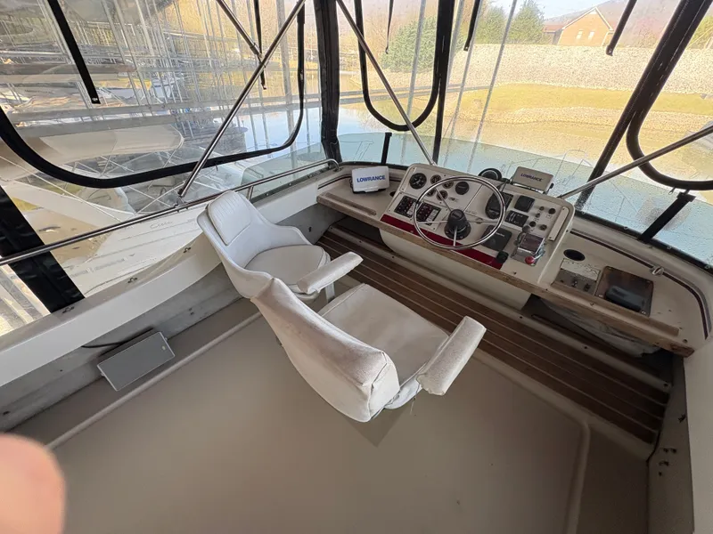 Slide: The Image of 1983 Mainship 34 Mark III helm station interior. - 23