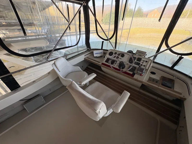 Slide: The Image of Interior view of a 1983 Mainship 34 Mark III yacht helm. - 24