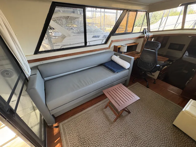 Slide: The Image of Interior of a 1983 Mainship 34 Mark III yacht with sofa and desk. - 26