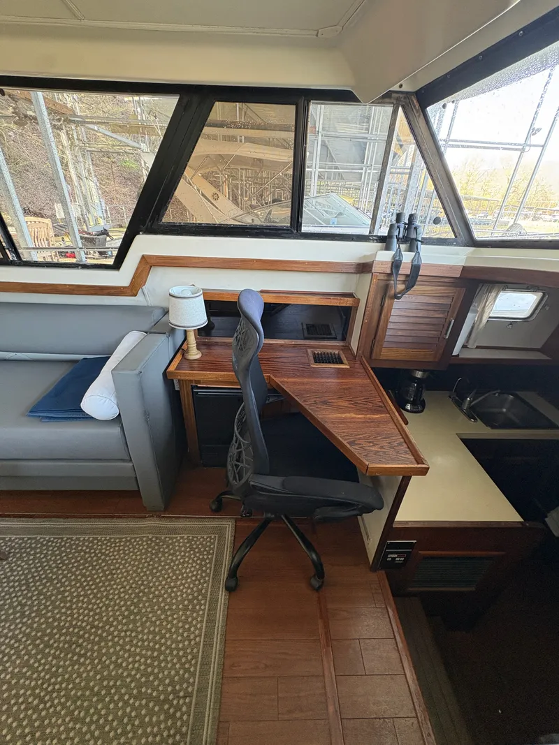 Slide: The Image of Interior of a 1983 Mainship 34 Mark III with desk and seating area. - 27