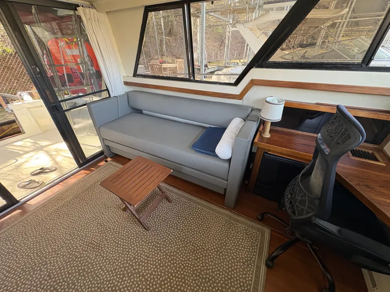 Slide: The Image of Interior of a 1983 Mainship 34 Mark III yacht with sofa and desk. - 28