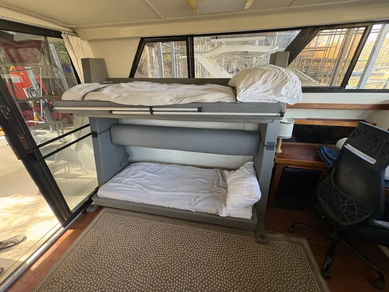 Slide: The Image of Interior of 1983 Mainship 34 Mark III with bunk beds. - 29