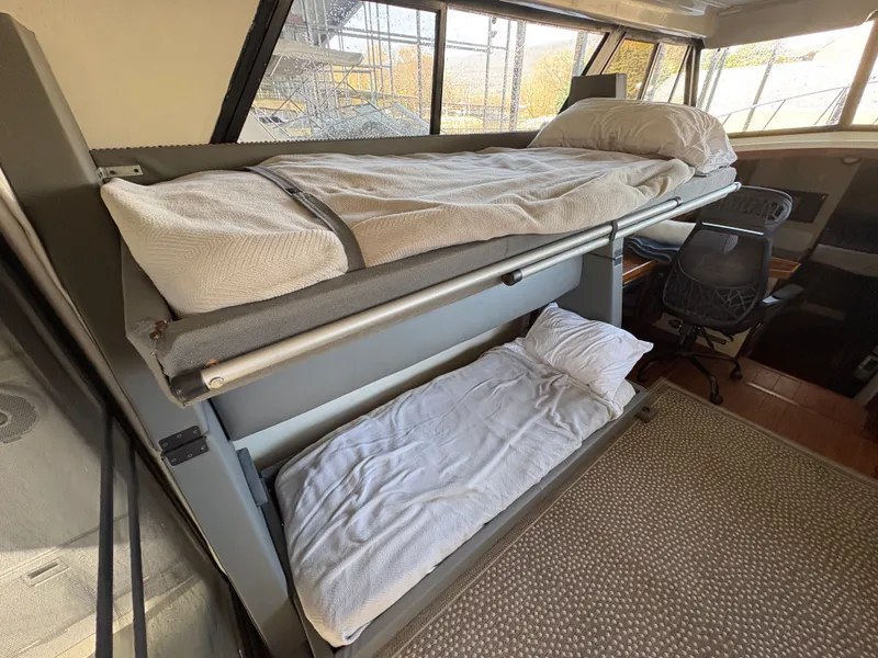 Slide: The Image of Interior of 1983 Mainship 34 Mark III with bunk beds. - 30